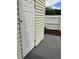 Back patio with white siding and a white door that leads into the house at 247 Debora Ct # 1, Altamonte Springs, FL 32701