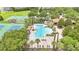 Aerial view of a pool, tennis courts, basketball court and other community recreation facilities surrounded by lush landscaping at 2724 Westyn Cove Ln, Ocoee, FL 34761