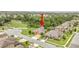 Areal view shows the house with well-maintained lawn, mature trees, and the quite neighborhood at 2724 Westyn Cove Ln, Ocoee, FL 34761