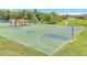 Well-maintained basketball court with colorful markings and multiple hoops, adjacent to a covered gazebo at 2724 Westyn Cove Ln, Ocoee, FL 34761