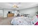 Spacious bedroom with carpet, ceiling fan, and a window at 2724 Westyn Cove Ln, Ocoee, FL 34761