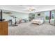 Large bedroom with lots of floor space, carpet, ceiling fan and two windows at 2724 Westyn Cove Ln, Ocoee, FL 34761