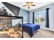 Bedroom with blue walls, carpet, ceiling fan, and a large terrarium at 2724 Westyn Cove Ln, Ocoee, FL 34761