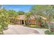 Charming single-story clubhouse with a red tile roof, arched windows, and meticulously maintained landscaping at 2724 Westyn Cove Ln, Ocoee, FL 34761