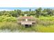 Lakefront property featuring a covered dock with scenic views and access to recreational activities at 2724 Westyn Cove Ln, Ocoee, FL 34761