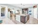 This kitchen boasts stainless steel appliances, granite countertops, tile flooring and a breakfast bar at 2724 Westyn Cove Ln, Ocoee, FL 34761