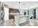 Kitchen featuring granite island, stainless appliances, and pendant lighting at 2724 Westyn Cove Ln, Ocoee, FL 34761