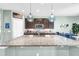 Gorgeous kitchen with granite countertops, stainless steel appliances, and a breakfast bar at 2724 Westyn Cove Ln, Ocoee, FL 34761