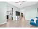Bright and airy living room featuring ceramic tile flooring and seamless access to the kitchen at 2724 Westyn Cove Ln, Ocoee, FL 34761