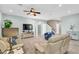 Living room boasts an open floor plan, and tile flooring, providing style and ease of maintenance at 2724 Westyn Cove Ln, Ocoee, FL 34761