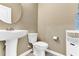 Powder room featuring a pedestal sink, white toilet and ceramic tiled floors at 2724 Westyn Cove Ln, Ocoee, FL 34761