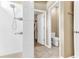 Bathroom featuring a shower with white tile, tiled floors, and a toilet room at 2724 Westyn Cove Ln, Ocoee, FL 34761