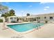 Expansive backyard featuring a pool, cabana, lush landscaping, and ample space for outdoor activities at 2906 E Grant Ave, Orlando, FL 32806