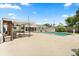 Spacious backyard with a large pool, cabana, and white fencing; perfect for relaxation and entertainment at 2906 E Grant Ave, Orlando, FL 32806
