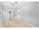 Bedroom with tile floor, ceiling fan, and doors leading to other rooms at 2906 E Grant Ave, Orlando, FL 32806
