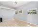 Bedroom with tile floor, ceiling fan, and windows for natural light at 2906 E Grant Ave, Orlando, FL 32806