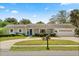 Charming single-story home with a well-maintained front yard and a two-car garage at 2906 E Grant Ave, Orlando, FL 32806