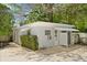 Charming exterior view of home with covered porch, tasteful landscaping, and lovely yard at 2906 E Grant Ave, Orlando, FL 32806
