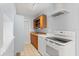 Cozy kitchen with stove, range hood, wooden cabinets, and sink at 2906 E Grant Ave, Orlando, FL 32806