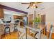 Eat-in kitchen with stainless steel appliances, wooden cabinetry, and a stone breakfast bar at 2906 E Grant Ave, Orlando, FL 32806