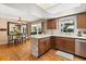 Kitchen with stainless steel appliances and island open to dining area at 2906 E Grant Ave, Orlando, FL 32806