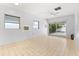 Bright living room with tile flooring, ceiling fan, and sliding glass doors to the yard at 2906 E Grant Ave, Orlando, FL 32806