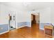 Cozy living room with hardwood floors and neutral-toned walls at 2906 E Grant Ave, Orlando, FL 32806