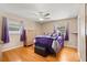 Inviting main bedroom with hardwood floors, natural light, and closet space at 2906 E Grant Ave, Orlando, FL 32806