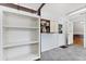 Functional mud room offers built-in shelving, storage cabinets, and access to the backyard and additional rooms at 2906 E Grant Ave, Orlando, FL 32806