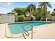 Inviting pool area is framed by lush landscaping and has a shed, outdoor decor, and a volleyball net at 2906 E Grant Ave, Orlando, FL 32806