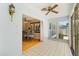 Bright sunroom features large windows with views into the dining area and lush green landscape at 2906 E Grant Ave, Orlando, FL 32806