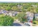 Aerial view of a home showcasing a well-maintained lawn and proximity to neighboring properties and street at 300 Augustine Ct, Oviedo, FL 32765