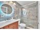 Sleek bathroom featuring a glass-enclosed shower, stylish vanity, and modern fixtures at 300 Augustine Ct, Oviedo, FL 32765