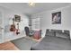 Bedroom featuring a desk, a comfortable chair, and musical instruments on the wall at 300 Augustine Ct, Oviedo, FL 32765