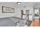 Bright bedroom featuring a gray comforter, decorative art, and a vanity with a mirror at 300 Augustine Ct, Oviedo, FL 32765