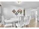 Bright dining area featuring tile flooring, a stylish table set, and decorative elements at 300 Augustine Ct, Oviedo, FL 32765