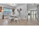Elegant dining area featuring tile flooring and a view into the backyard at 300 Augustine Ct, Oviedo, FL 32765
