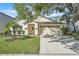 Charming single-story home featuring a well-manicured lawn and a two-car garage at 300 Augustine Ct, Oviedo, FL 32765