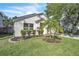 Landscaped front yard with lush green grass and decorative shrubbery at 300 Augustine Ct, Oviedo, FL 32765