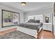 Main bedroom with hardwood floors, statement art piece, and large window for natural light at 300 Augustine Ct, Oviedo, FL 32765