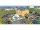 Aerial view of hotel, showcasing well-maintained landscaping and pool area at 3000 Maingate Ln # 504, Kissimmee, FL 34747