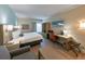 Cozy Galleria hotel bedroom with desk, dresser and king size bed at 3000 Maingate Ln # 504, Kissimmee, FL 34747