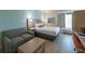 Comfortable Galleria hotel bedroom with couch, desk, and king size bed at 3000 Maingate Ln # 504, Kissimmee, FL 34747