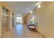 Well-lit Galleria hallway with elevators and table and chairs at 3000 Maingate Ln # 504, Kissimmee, FL 34747