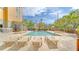 Inviting outdoor pool area with lounge chairs for relaxing in the sun at 3000 Maingate Ln # 504, Kissimmee, FL 34747