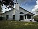 Backyard featuring a well maintained lawn, patio space and white siding at 3063 Ash Park Loop, Winter Park, FL 32792