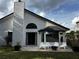 Backyard featuring a well maintained lawn, patio space and white siding at 3063 Ash Park Loop, Winter Park, FL 32792