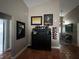 Stylish bar area with elegant furniture, decorative mirrors and terracotta tile at 3063 Ash Park Loop, Winter Park, FL 32792