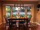 Inviting dining room featuring a bay window, a chandelier and terracotta tile at 3063 Ash Park Loop, Winter Park, FL 32792