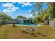Relaxing backyard features a sparkling swimming pool and a cozy seating area, perfect for entertaining at 314 Avalone Dr, Apopka, FL 32703